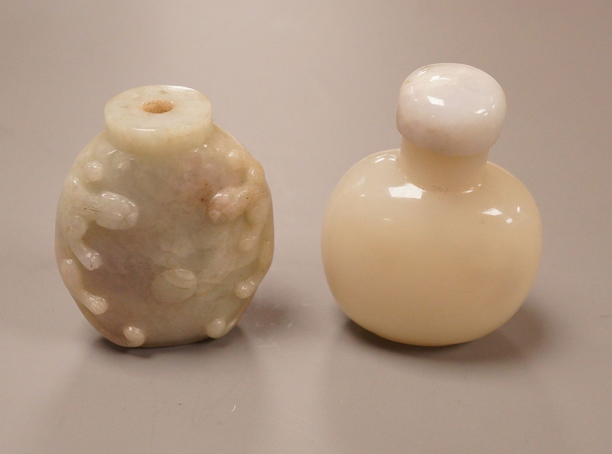 A Chinese jadeite snuff bottle and a glass snuff bottle